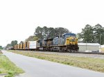 CSX 449 (missing its number boards) leads train 231-25 towards the yard